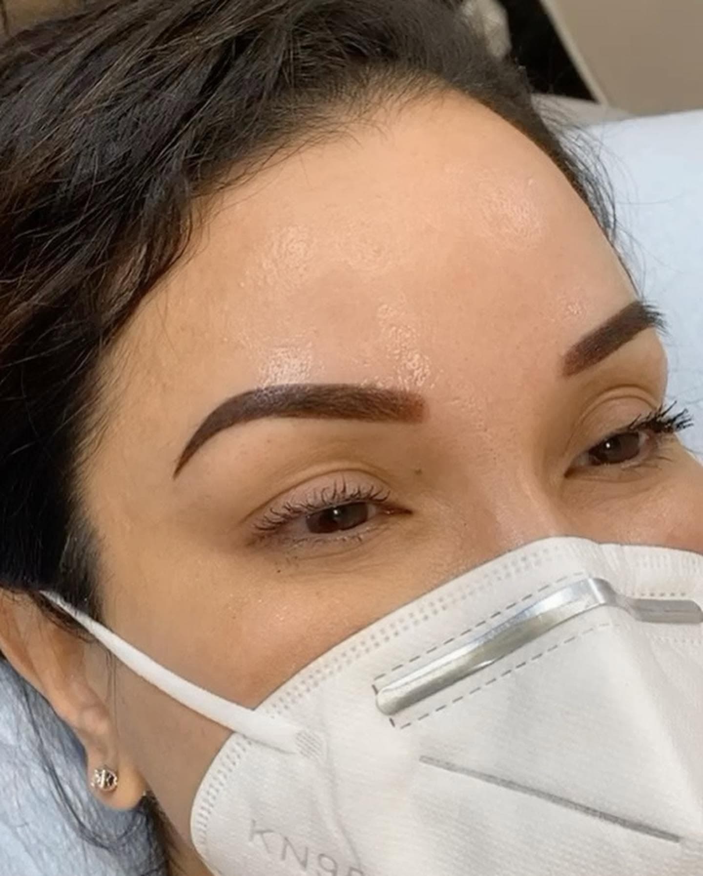 Powdered brow result after permanent makeup
